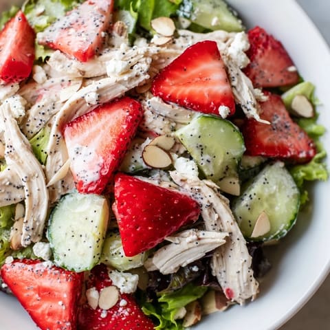 Freshly shredded chicken, sweet sliced strawberries, and crisp cucumber on salad greens, all drizzled with creamy homemade poppy seed dressing.